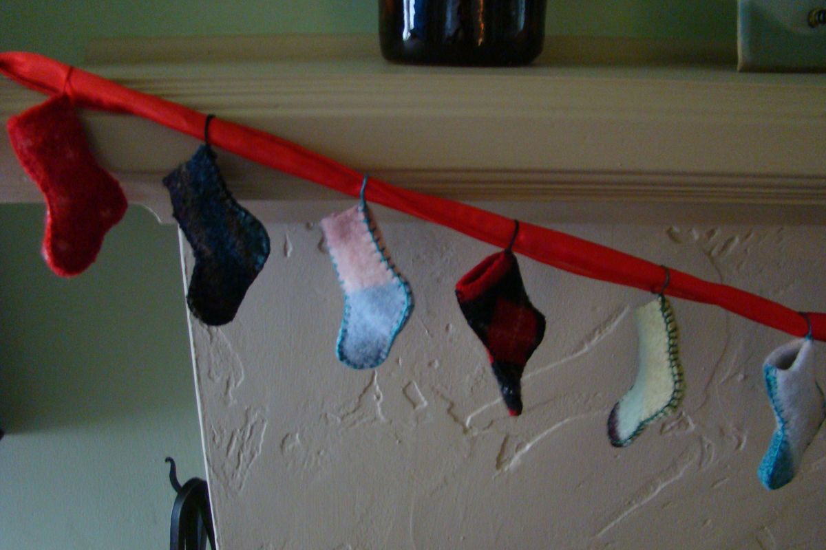 Hang stockings from ribbon, and get ready to count down to Christmas! (Maggie Bullock)