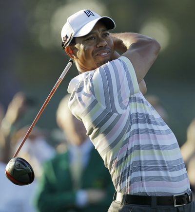 Tiger Woods tees off at the first hole during a practice round Monday at Augusta, Ga.  (Associated Press)