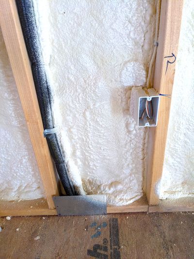 This is closed-cell foam insulation. The entire wall cavity is not filled because it may be step one of a hybrid combination of foam plus fiberglass.  (Tribune Content Agency)