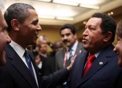 Venezuela’s President Hugo Chavez, right, speaks Friday with President Barack Obama in Port-of-Spain, Trinidad and Tobago.  (Associated Press / The Spokesman-Review)