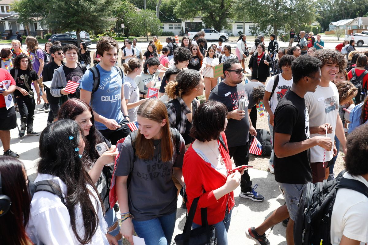 At noon, Hillsborough High School students in Tampa, Fla., walk out of classrooms in protest Friday.  (Jefferee Woo/Tampa Bay Times/TNS)