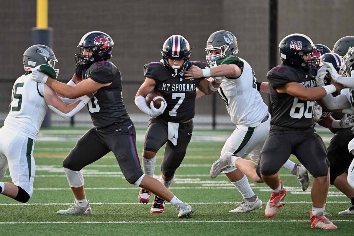 Mt. Spokane’s Matteo Saccomanno finds running room against Ridgeline during Friday’s Greater Spokane League game in Mead.  (COLIN MULVANY/THE SPOKESMAN-REVIEW)