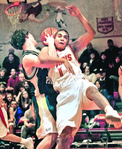 
Ferris' Erick Cheadle, right, is fouled by Shadle Park's Aaron Dunn in the first quarter.
 (Brian Plonka / The Spokesman-Review)