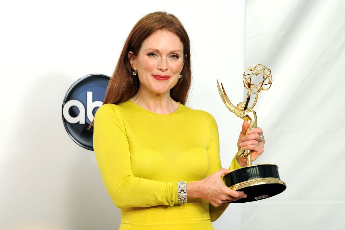 Actress Julianne Moore, winner  of the Outstanding Lead Actress In A Miniseries or Movie for "Game Change", poses backstage at the 64th Primetime Emmy Awards at the Nokia Theatre on Sunday, Sept. 23, 2012, in Los Angeles. (Photo by Jordan Strauss/Invision/AP) (Jordan Strauss / Invision)
