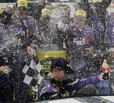 
Denny Hamlin gets doused by his teammates after winning the LENOX Industrial Tools 300. Associated Press
 (Associated Press / The Spokesman-Review)