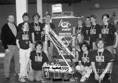 
Members of the regional robotics tournament team from St. George's School pose with Robot No. 1595. In the rear row, from left, are mentor Eric Miesch, Charlie Stangle, Josh Lambeth (Northwest Christian School), Matthew Kerschen, Stephen Shuler, faculty adviser Rick DeFord, Brannon Heftel and Elisabeth DeLeeuw; and in front row, are Daniel Copeland, John Cambareri, Robot No. 1595, Sarah Coombs, Abe Moland and Sam King. 
 (Courtesy of St. George's School / The Spokesman-Review)