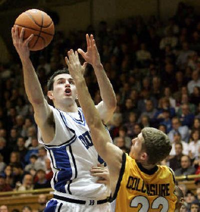 
Duke's J.J. Redick shoots over Valparaiso's Seth Colclasure.
 (Associated Press / The Spokesman-Review)