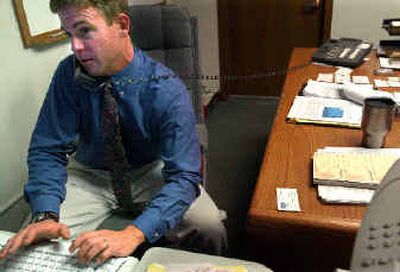 
Erik Skaggs works in his new office as the county's new economic development director on Friday. 
 (Jed Conklin / The Spokesman-Review)