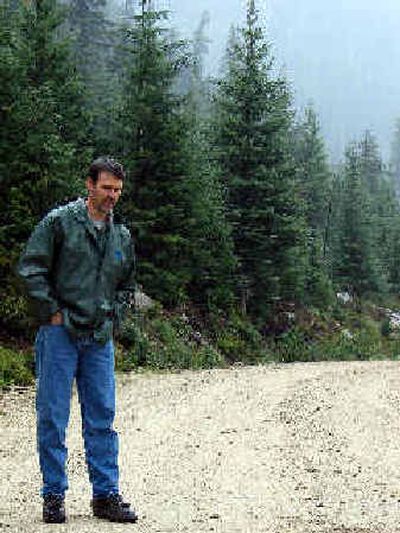 
Pat Behrens, silviculturist  for the Bonners Ferry district of the U.S. Forest Service, discusses the Healthy Forests Restoration Act with a group of North Idaho residents Monday. The group visited the Myrtle Creek valley, which was burned by a wildfire last year. 
 (James Hagengruber / The Spokesman-Review)