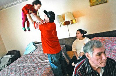 
Darrell Azure, right, and some of his family members spend time Wednesday  at the West Wynn Motel in Spokane. The homeless family from the Turtle Mountain Chippewa Tribe from North Dakota will be forced to once again look for shelter today after their funds run dry. 
 (Photosby Brian Plonka / The Spokesman-Review)