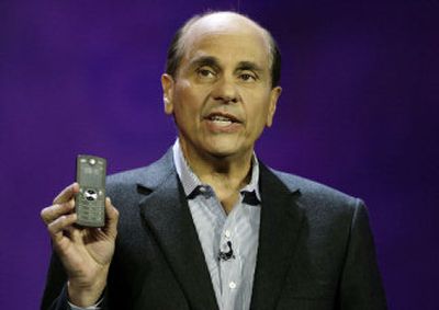 
Ed Zander, chairman and CEO, Motorola Inc. shows the Motofone, a new phone with a high-contrast reflective display. 
 (Associated Press / The Spokesman-Review)