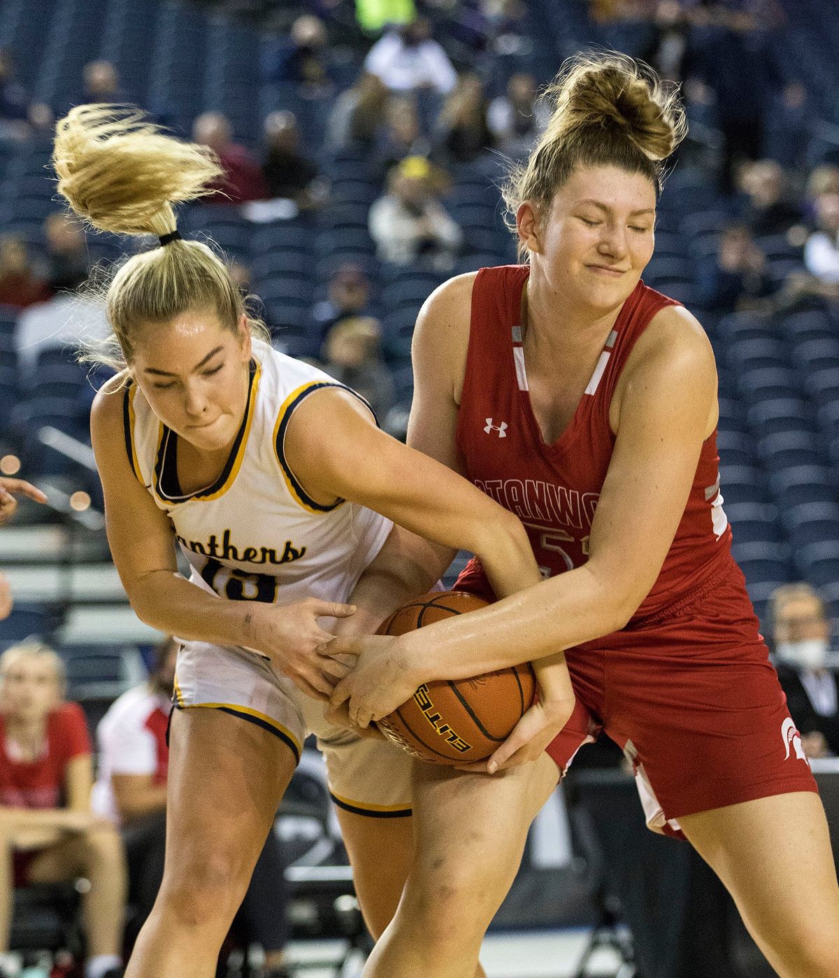 Mead’s Natalie Braun, left, battles Stanwood’s Vivienne Berrett for a rebound during action in the 3A Girls State Basketball Tournament in Tacoma, Wash. on Thursday, March 3, 2022. Mead won the game 52-33 to advance to the semi-finals. (Photo by Patrick Hagerty)  (Patrick Hagerty)