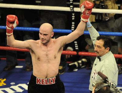 Boxer Kelly Pavlik has his arm raised in victory by referee Frank Garza.  (Associated Press / The Spokesman-Review)