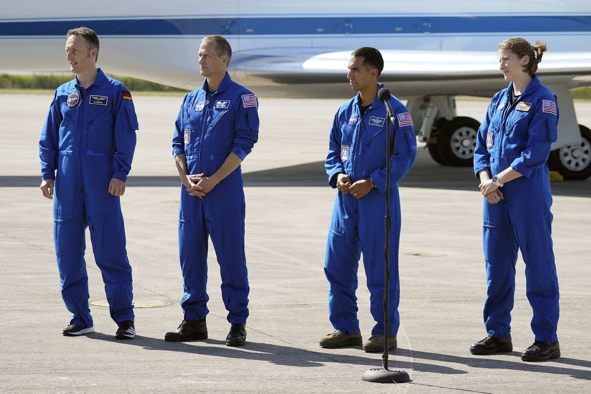 Crew 3 astronauts, from left, European Space Agency astronaut Matthias Maurer, of Germany, NASA astronauts Tom Marshburn, Raja Chari, and Kayla Barron speak to the media after arriving at the Kennedy Space Center in Cape Canaveral, Fla., Tuesday, Oct. 26, 2021. The mission with a crew of four astronauts will launch aboard a Crew Dragon spacecraft on SpaceX