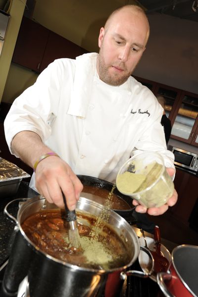 Chef Hosea Rosenberg adds filé to a pot of gumbo last month  in Boulder, Colo.  (Associated Press)