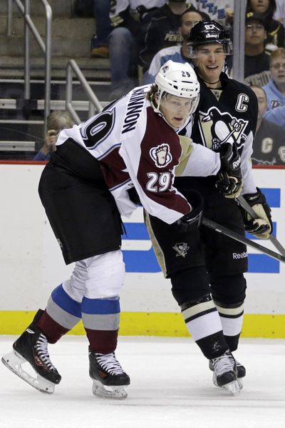 Colorado’s Nathan MacKinnon, left, faced fellow Cole Harbour, Nova Scotia, compatriot Sidney Crosby, right, for the first time. (Associated Press)