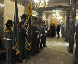 OLYMPIA -- Members of the Washington State Patrol Honor Guard wait in the wings of the state Senate for the opening ceremonies on Monday, Jan. 13, 2013 (Jim Camden)