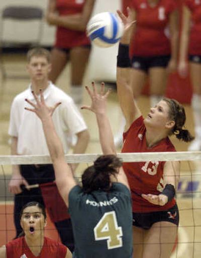 
EWU's Hayley Hills, right, sails above the net to score against Sacramento's Maddison Thivierge.
 (Dan Pelle / The Spokesman-Review)