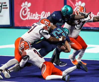 Spokane Shock defensive back Cedric Poole, bottom, boosts a defense yielding just 29 points a game in the high-scoring Indoor Football League.  (Courtesy of Dylan Arazi )