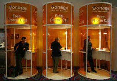 
Attendees make free phone calls over VoIP at the Vonage booth at the 2007 International Consumer Electronics Show in Las Vegas. VoIP use continues to climb worldwide, especially in Europe. Associated Press
 (Associated Press / The Spokesman-Review)