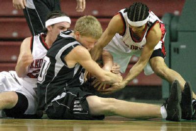 
Almira/Coulee-Hartline's Kyle Tucker, center, battles two Neah Bay players for the ball. 
 (Gordon King Special to the Spokesman-Review / The Spokesman-Review)