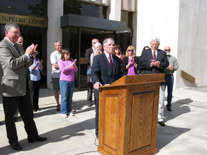 Clive Strong speaks at a press conference in front of the Idaho Supreme Court on Thursday; at left is House Speaker Scott Bedke (Betsy Z. Russell)