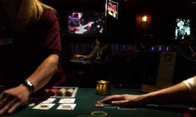 
Paigow Poker and the blues via music video set the scene at Spokane's Bluz at the Bend on Tuesday. Bluz and the Bend is one of four new casinos to open in Spokane County during the past year.
 (Brian Plonka / The Spokesman-Review)