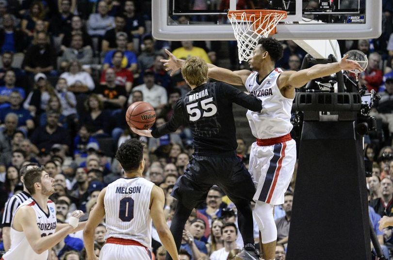 Gonzaga forward Johnathan Williams defends the rim against Xavier guard J.P. Macura in Saturday’s win that sent the Zags to the Final Four. (Dan Pelle / The Spokesman-Review)
