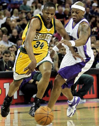 Sonics' Ray Allen drives past Kings' Bonzi Wells en route to a game-high 26 points. Seattle concludes its season at home versus Denver tonight.
(Associated Press / The Spokesman-Review)
