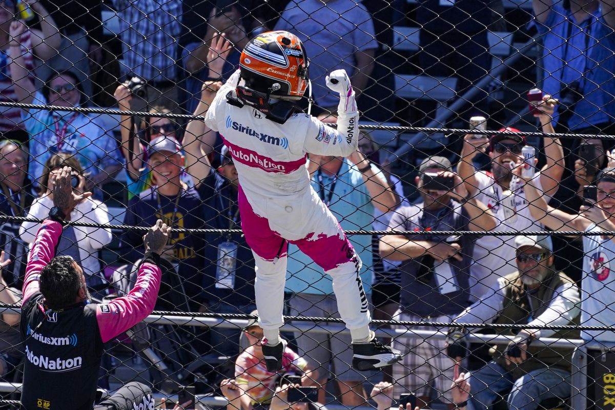 Helio Castroneves of Brazil celebrates after winning the Indianapolis 500 auto race at Indianapolis Motor Speedway in Indianapolis, Sunday, May 30, 2021.  (Darron Cummings)