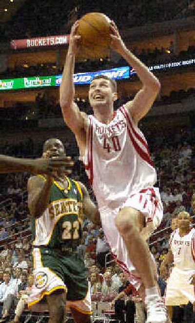 
Ryan Bowen of the Houston Rockets drives to the basket against the Seattle SuperSonics' Ronald Murray during the second quarter.
 (Associated Press / The Spokesman-Review)