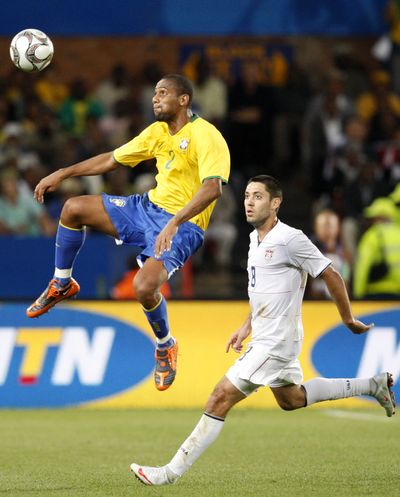 Brazil’s Maicon, left, battles against Clint Dempsey of Team USA.  (Associated Press / The Spokesman-Review)