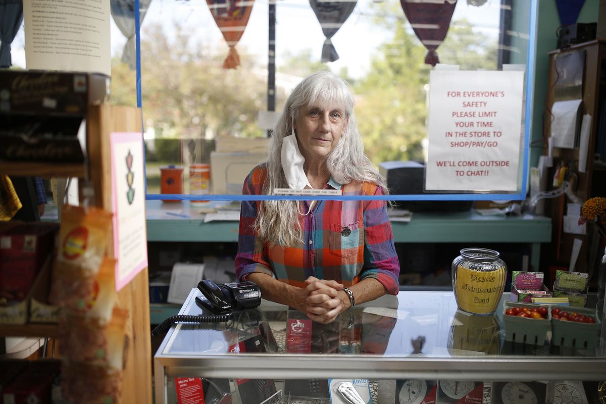 In North Carolina, retail clerk Lori Wagoner put a shield over her register to protect herself from the coronavirus.  (Eamon Queeney for the Washington Post)