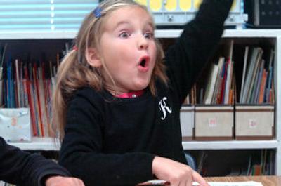 
Kaitlyn Morford,  a first-grader at Dalton Elementary, realizes she knows the word (grass) her reading group was trying to sound out Thursday in a session with teacher Brooke Dunton. The sessions are part of a program called 