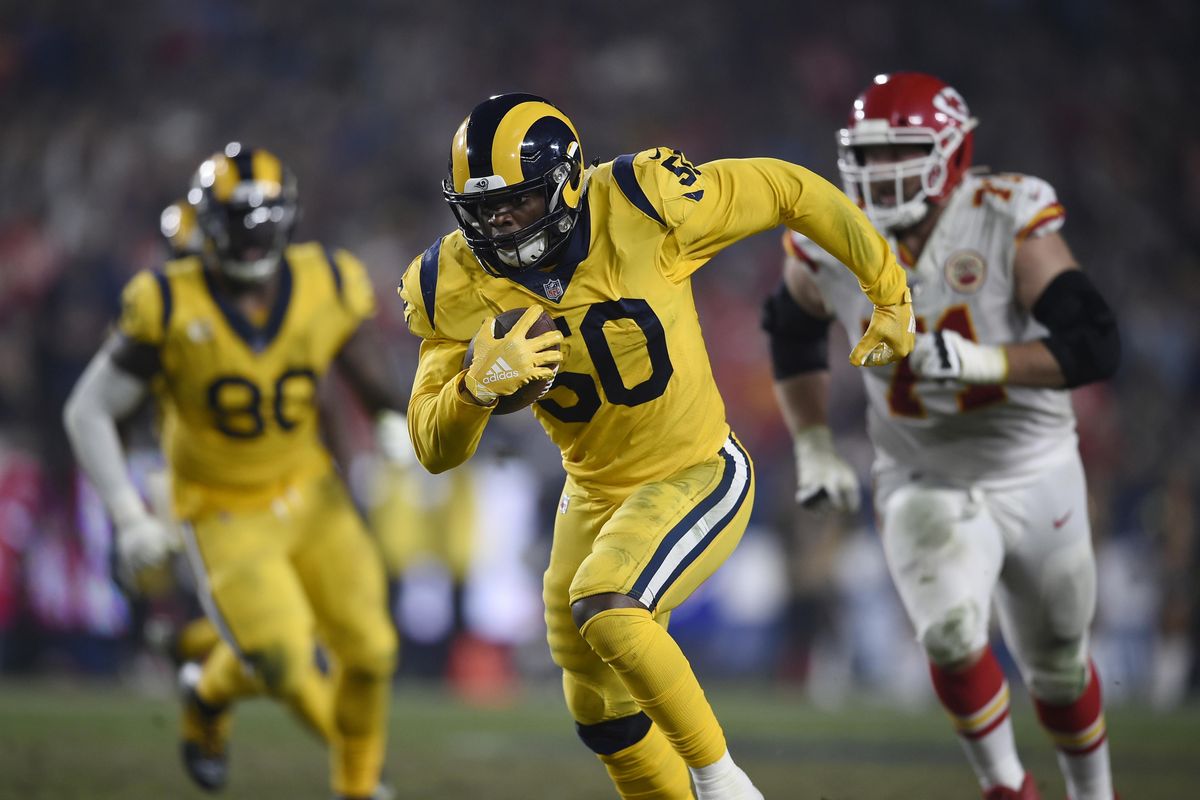 Los Angeles Rams outside linebacker Samson Ebukam runs for a touchdown after making an interception during the second half of a 54-51 victory over the Kansas City Chiefs on November 19, 2018. (Kelvin Kuo / Associated Press)