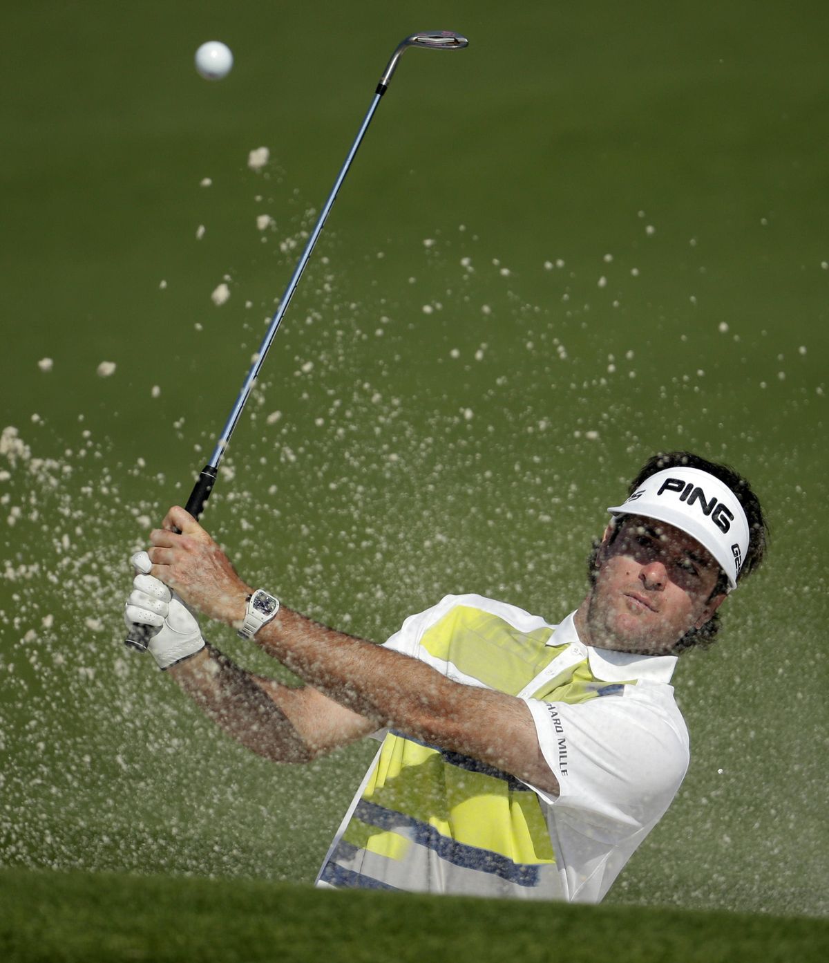 Bubba Watson hits out of a bunker on the second hole on his way to taking the biggest 36-hole lead at the Masters since 2006. (Associated Press)