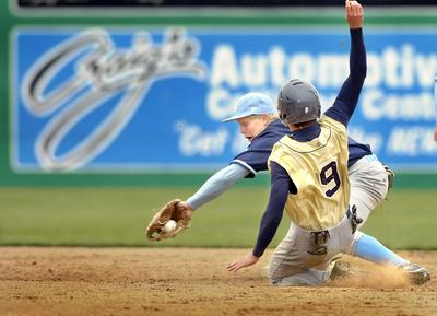 CV’s David Borgman  tags out Mead’s Paul Miller trying to steal.  (Christopher Anderson / The Spokesman-Review)