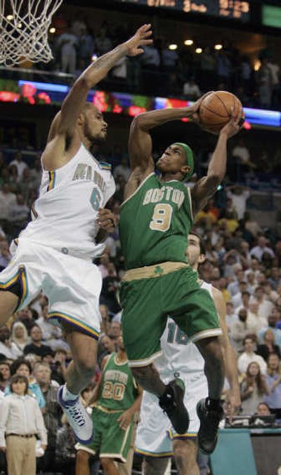 
New Orleans' Tyson Chandler impedes Boston's Rajon Rondo.Associated Press
 (Associated Press / The Spokesman-Review)