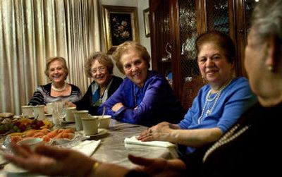 
Francis Reillo weaves a tale that all the ladies know by heart, but Lida Cozza, Dora Martia, Gerturde Naccarto and Franca Manchini listen and laugh anyway during their bi-monthly Sunshine Sewing Group meetings. The group has been together for 25 years, and although they don't sew anymore, they still get together for gooey desserts, coffee and gossip. 
 (Amanda Smith / The Spokesman-Review)