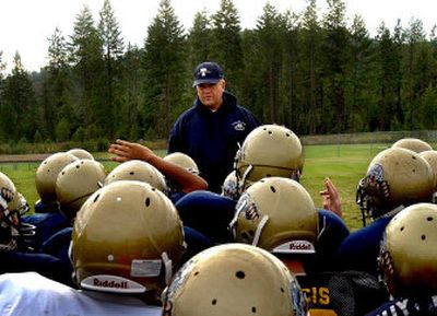 
Head coach Roy Albertson of Timberlake, gathering his players at practice on Tuesday, returns just two of 22 starters from last year's Intermountain League championship team. 
 (Kathy Plonka / The Spokesman-Review)