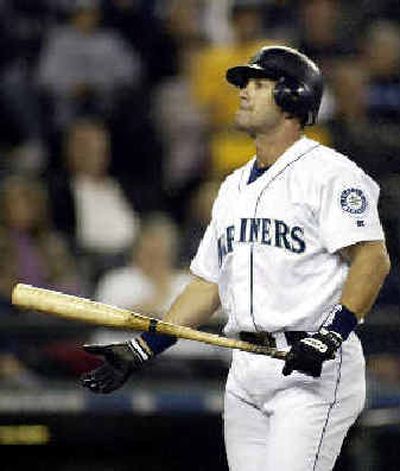 
Edgar Martinez returns to the dugout after striking out in the fifth inning. 
 (Associated Press / The Spokesman-Review)