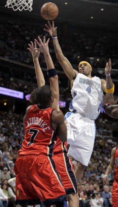 
Kenyon Martin shoots over two Warriors on his way to 30 points. Associated Press
 (Associated Press / The Spokesman-Review)