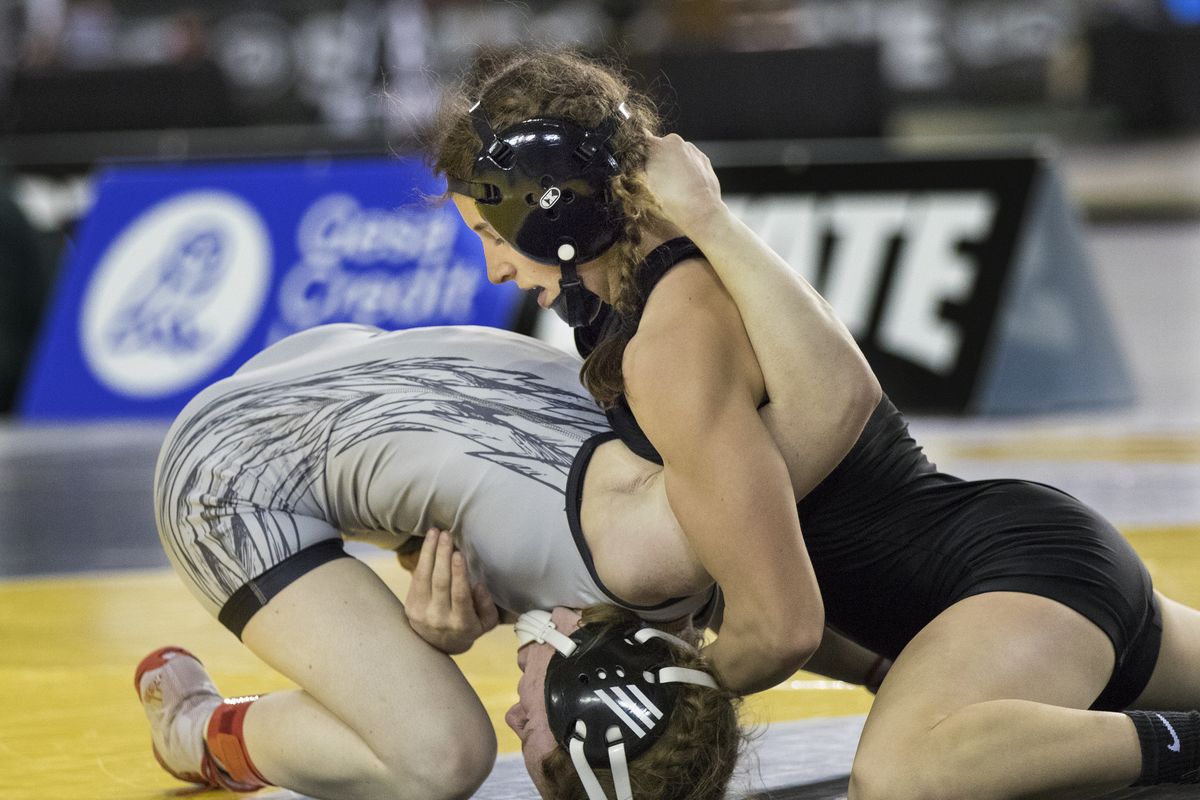 University’s Libby Roberts, above, looks to turn Clarkston’s Caila Rice during their 105-pound match Saturday at the Girls State Wrestling Championships in Tacoma. Roberts won the match 9-0 to win her first state championship as a freshman.  (Patrick Hagerty/For The Spokesman-Review)