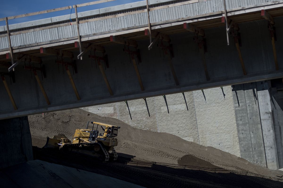 Construction continues Wednesday during a news conference at the North Spokane Corridor in Spokane. (Tyler Tjomsland)