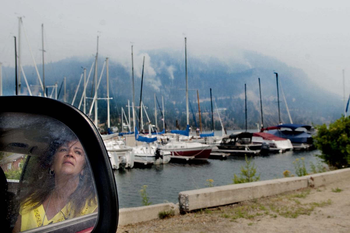 “It’s unbelievable,” Bayview resident Linda Greco said as she watched the fire burn Monday. The fire has burned more than 2,000 acres. (Kathy Plonka)