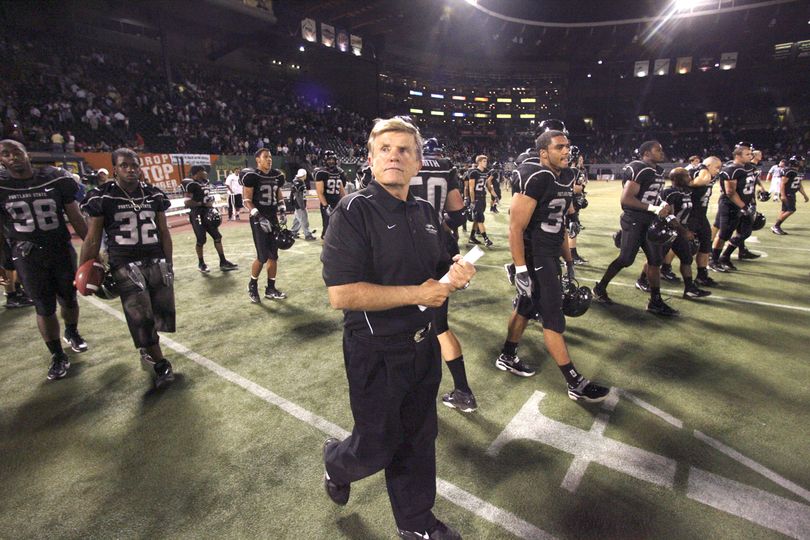 FILE - In this Sept. 8, 2007, file photo, Portland State coach Jerry Glanville walks off field with his players after a 26-17 loss to UC Davis in an NCAA college football game in Portland, Ore.   Glanville resigned on Tuesday, Nov. 17, 2009, after three years as head coach of the Portland State. (Rick Bowmer / Associated Press)