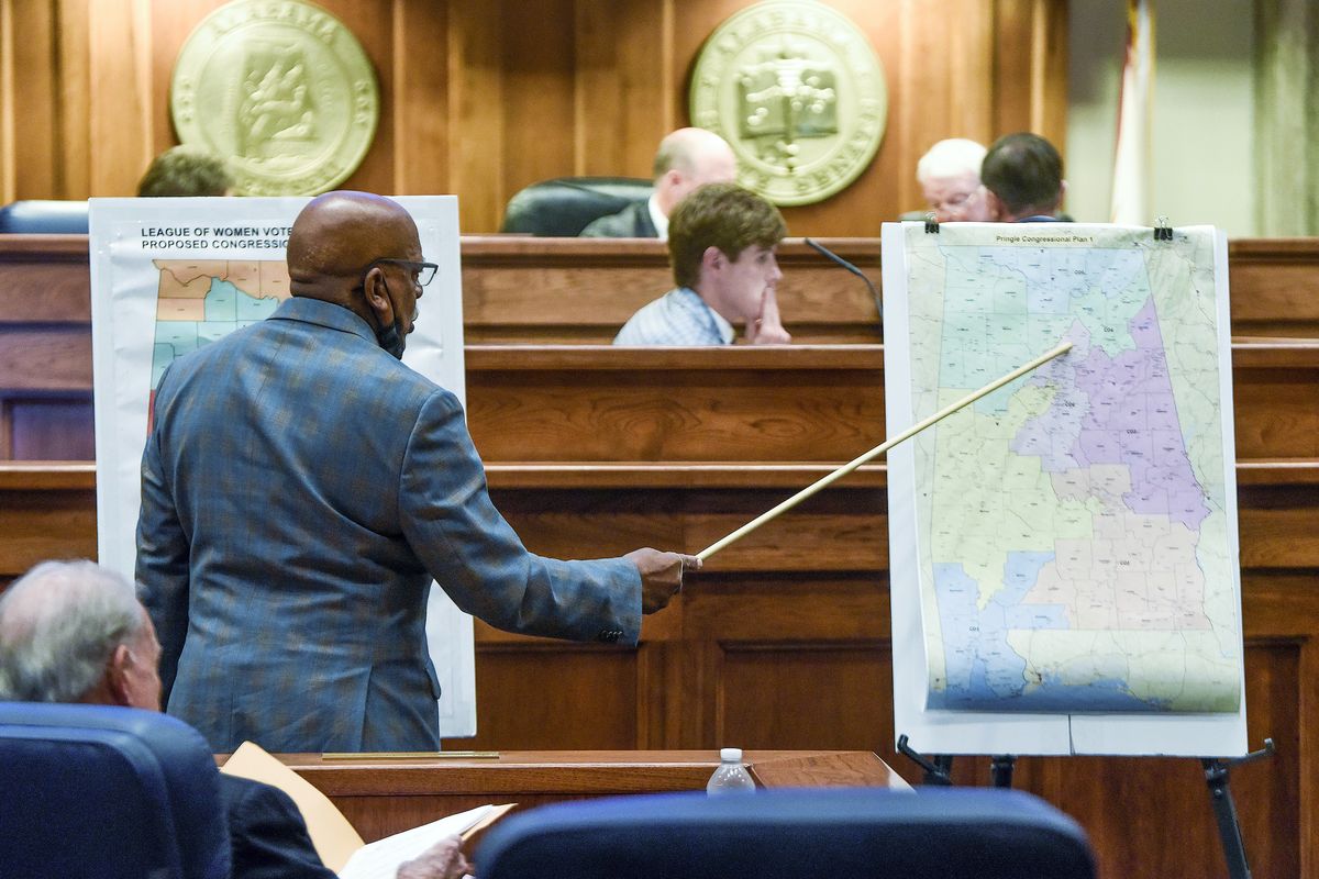 FILE - Sen. Rodger Smitherman compares U.S. Representative district maps during the special session on redistricting at the Alabama Statehouse in Montgomery, Ala., Nov. 3, 2021. (Mickey Welsh)