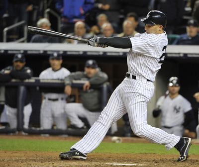 Raul Ibanez connects for the winning homer in the 12th inning Wednesday as the New York Yankees defeated the Oakland A's 3-2. (Associated Press)