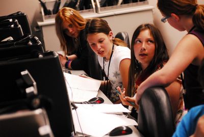 Editor-in-chief Cassandra Ford, left, reporter Neely Harding, center, and editor-in-chief Veronica Franzese  work on writing and editing stories as they put out the final edition of the University Elementary School’s Unicorn Press on Tuesday. (J. BART RAYNIAK / The Spokesman-Review)