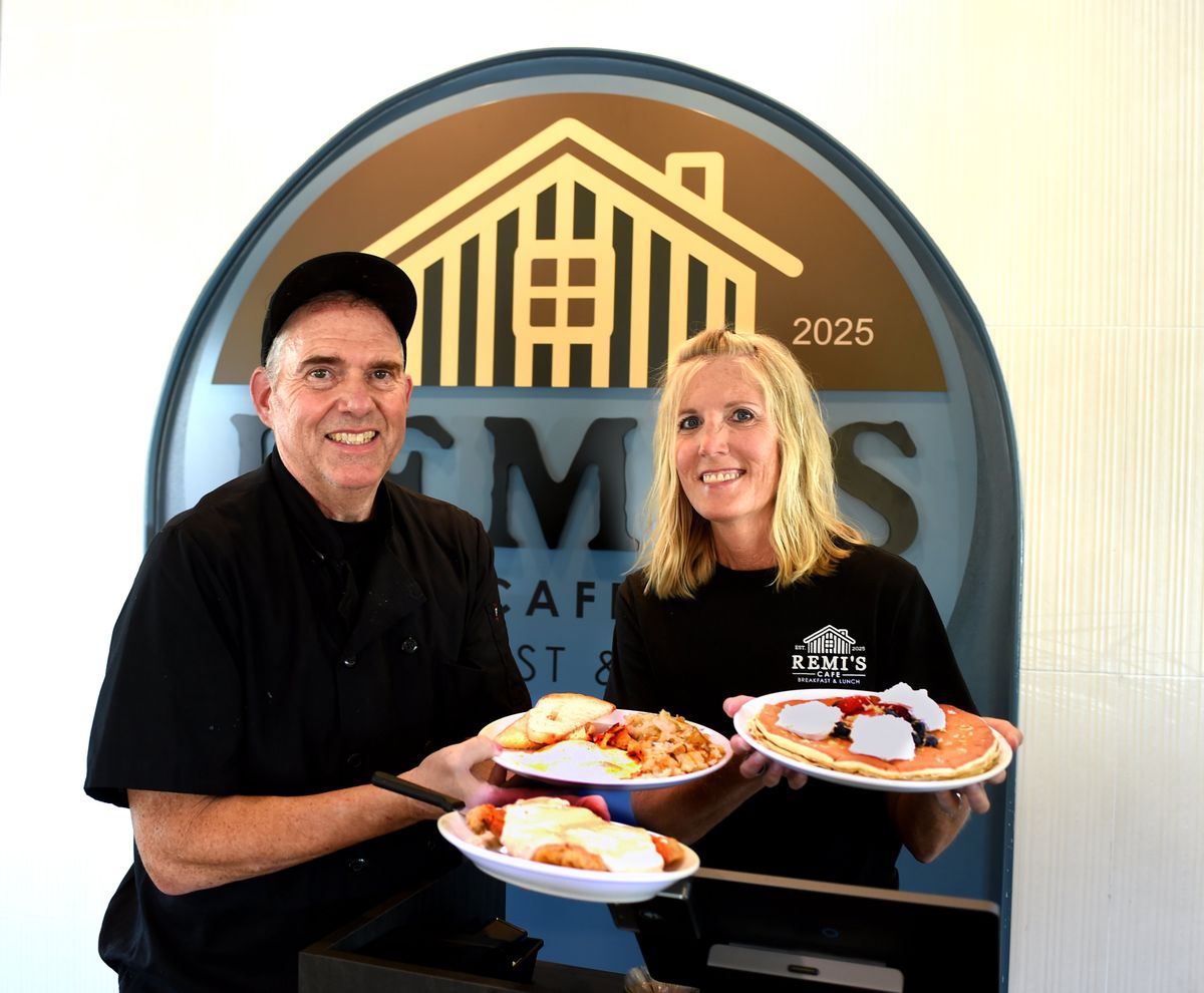 Paul and Brenda Gill hold two of their popular dishes they are offering in their new Remi’s Cafe. They have taken the former Shari’s site at 12502 N. Division St. and upgraded the newly remodeled dining spot. Paul holds the Chicken Fried Steak served with eggs, hash browns and toast while Brenda holds the Lemon Cloud pancakes. (Christopher Anderson/For The Spokesman-Review)